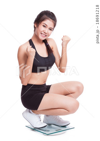 Happy woman with scales on white background 18691218
