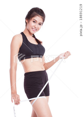 young woman taking measurements of her body 18691219