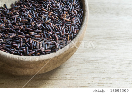 Black rice in wooden bowl Black rice in wooden bowl 18695309