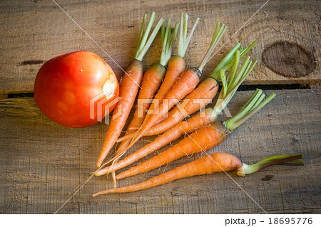 tomatoes and baby carrots tomatoes and baby carrots 18695776