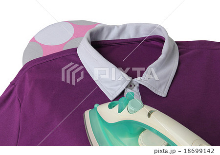 Smoothing a casual shirt with iron on the board Smoothing a casual shirt with iron on the board 18699142