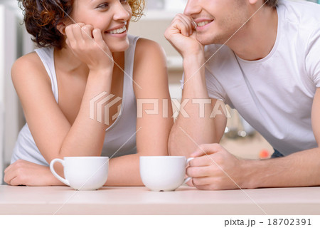 Happy couple drinking coffee Happy couple drinking coffee 18702391