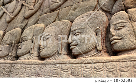 Stone faces of Khmer warriors Stone faces of Khmer warriors 18702693