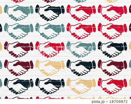 Political concept: Handshake icons on wall Political concept: Handshake icons on wall 18709872