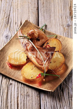 Roast lamb chops and potatoes 18710424