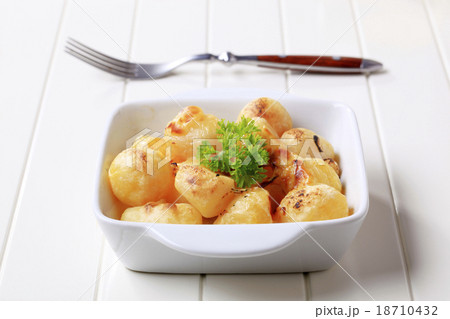 Cheese coated potatoes Cheese coated potatoes 18710432
