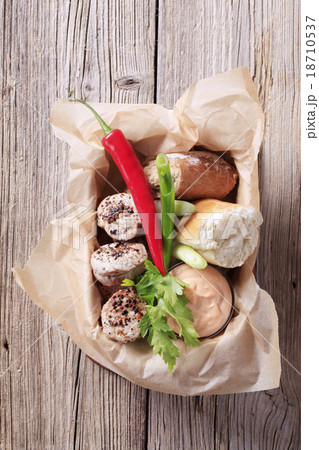 Roast pork tenderloin with bread roll 18710537