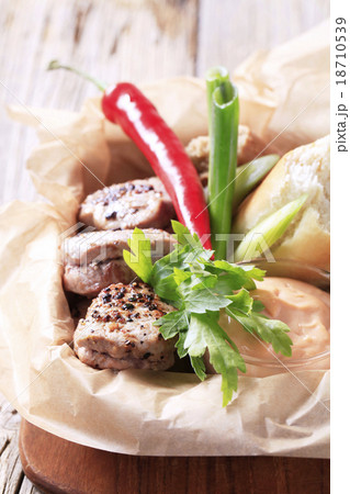 Roast pork tenderloin with bread roll Roast pork tenderloin with bread roll 18710539