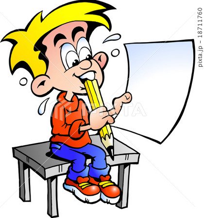 school boy sitting at a desk with a paper  18711760