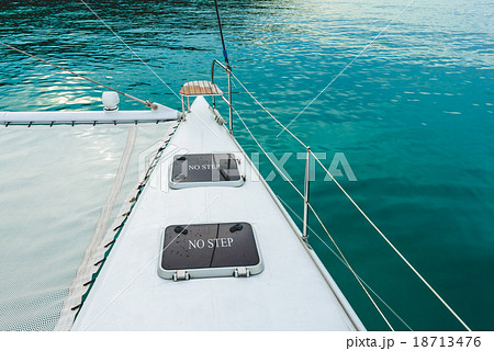 Empty catamaran yacht deck sailing on the sea Empty catamaran yacht deck sailing on the sea 18713476
