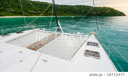 Empty catamaran yacht deck sailing on the sea Empty catamaran yacht deck sailing on the sea 18713477