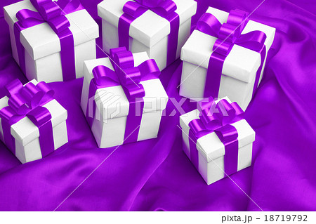 gift on purple satin background gift on purple satin background 18719792