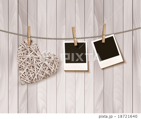 Wooden heart with photographs on rope. Vector. 18721640