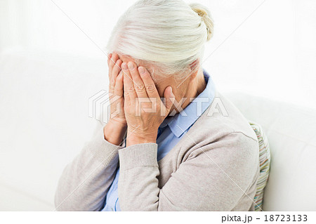 senior woman suffering from headache or grief senior woman suffering from headache or grief 18723133