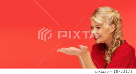 woman holding something on palms of her hands 18723173