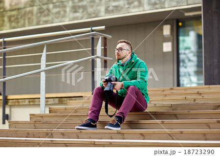 young hipster man with digital camera in city young hipster man with digital camera in city 18723290