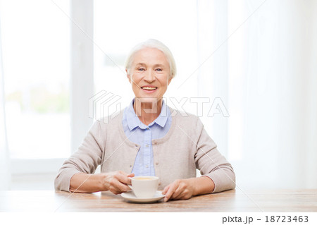 happy senior woman with cup of coffee 18723463