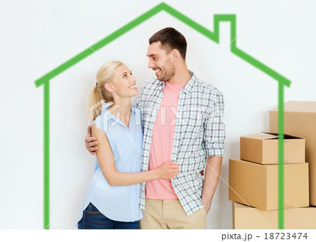 couple with cardboard boxes moving to new home 18723474