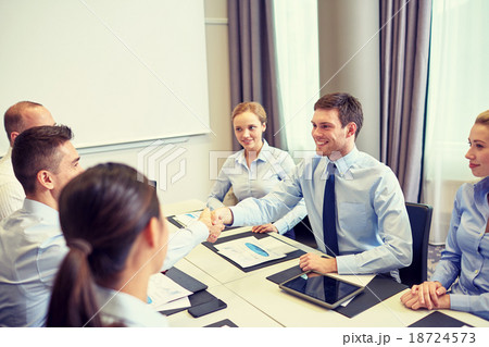group of smiling business people meeting in office group of smiling business people meeting in office 18724573