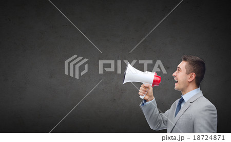 happy businessman in suit speaking to megaphone happy businessman in suit speaking to megaphone 18724871