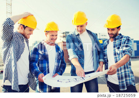group of builders with tablet pc and blueprint 18725059