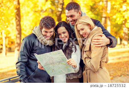 group of friends with map outdoors group of friends with map outdoors 18725532