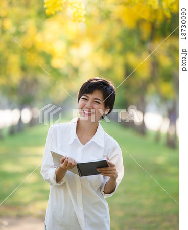 portrait of young  woman and book in hand 18730090
