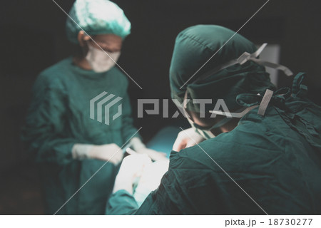Surgery team operating in a surgical room Surgery team operating in a surgical room 18730277