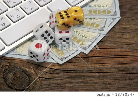 Keyboard, Gaming Dices And Cash On Wood Backgrou 18730547