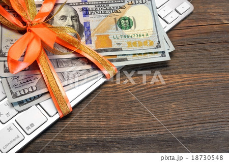 Money Tied With A Ribbon On The Keyboard 18730548