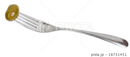 fork with impaled green olive isolated fork with impaled green olive isolated 18731451