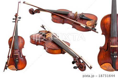 set of old violins with bows isolated on white 18731644
