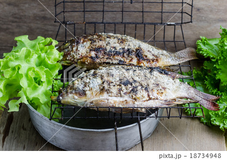 Salt crusted grilled nile tilapia fish Salt crusted grilled nile tilapia fish 18734948
