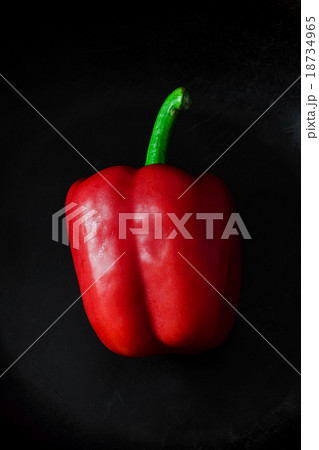 Red Peppers on dark frying pan 18734965
