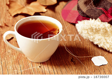 a cup with a tea bag 18736007