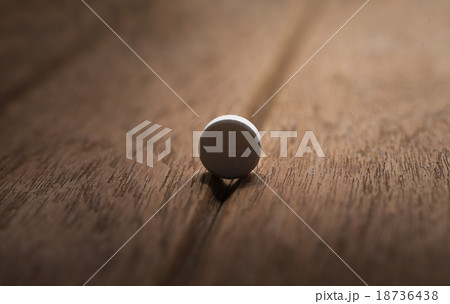 still life Dangerous pill on dark wood background 18736438