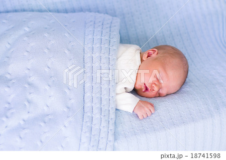 Newborn baby boy on a blue blanket Newborn baby boy on a blue blanket 18741598