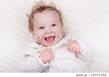 Baby girl on knitted blanket Baby girl on knitted blanket 18741599
