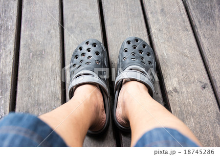 Shoes from an aerial view on wooden background Shoes from an aerial view on wooden background 18745286