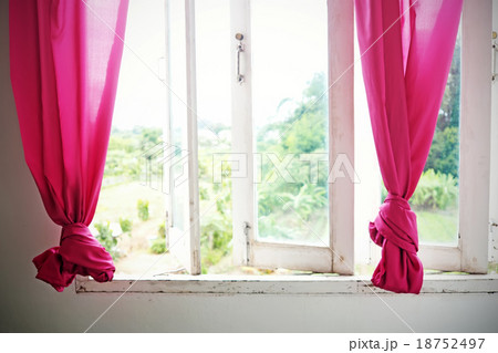 Pink curtain and white wooden window. Pink curtain and white wooden window. 18752497