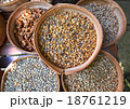 Various unroasted coffee beans on different bamboo 18761219