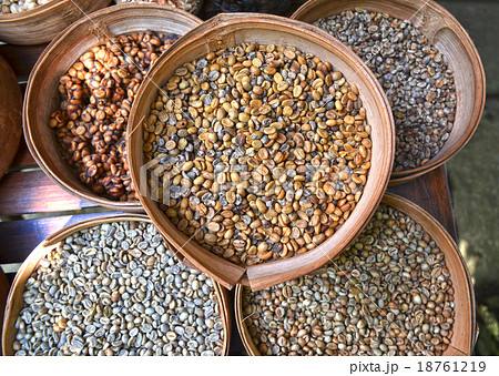 Various unroasted coffee beans on different bamboo Various unroasted coffee beans on different bamboo 18761219