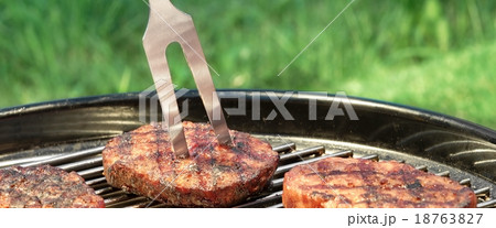 BBQ Hamburger And Chili Pepper On The Hot Grill 18763827