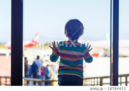 little tired kid boy at the airport, traveling little tired kid boy at the airport, traveling 18764423