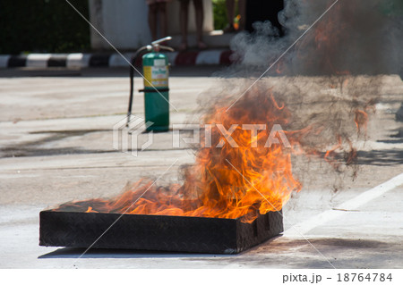 Flame in container on fire fighting training Flame in container on fire fighting training 18764784