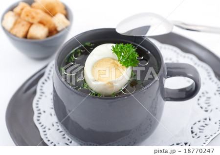Chicken broth with half of an egg Chicken broth with half of an egg 18770247