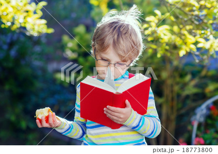 Little kid boy with apple on way to school Little kid boy with apple on way to school 18773800