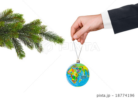 Hand with earth and Christmas tree 18774196