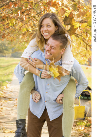 Happy couple in the park having fun 18774639