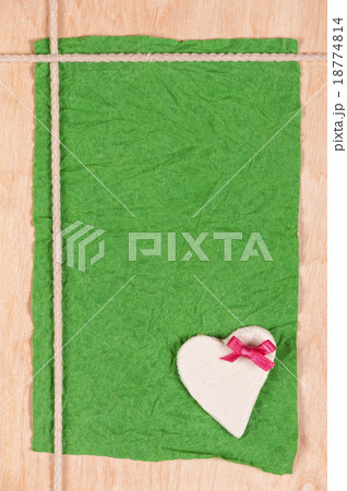 card from crumpled paper, stone heart and rope  18774814